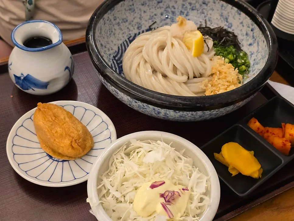 Inari sushi and salad served as standard side dishes