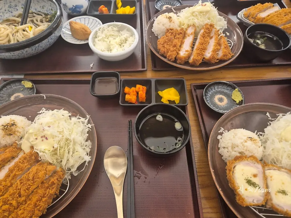 Table spread with basic tonkatsu, cheese tonkatsu, and cold udon