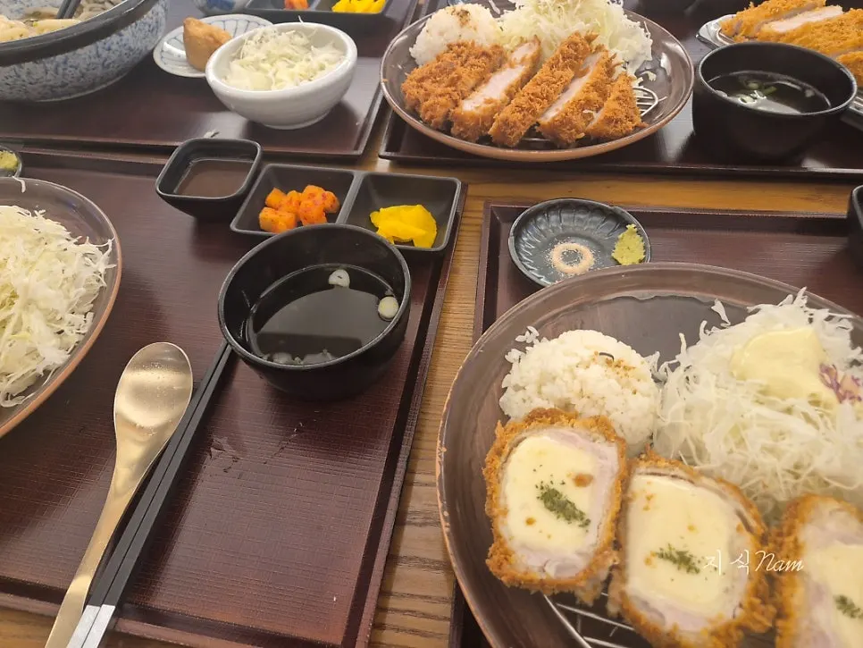 Tonkatsu and cold udon served together on the table