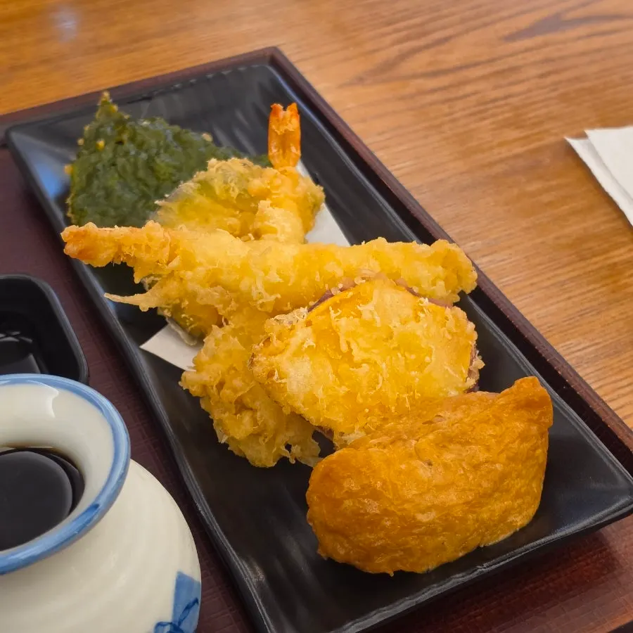 Three pieces of chicken thigh karaage on top of the udon
