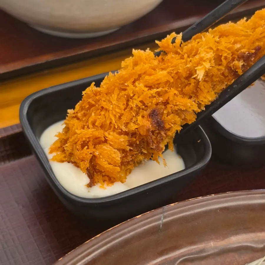 Broth and sauces served with the mixed tonkatsu