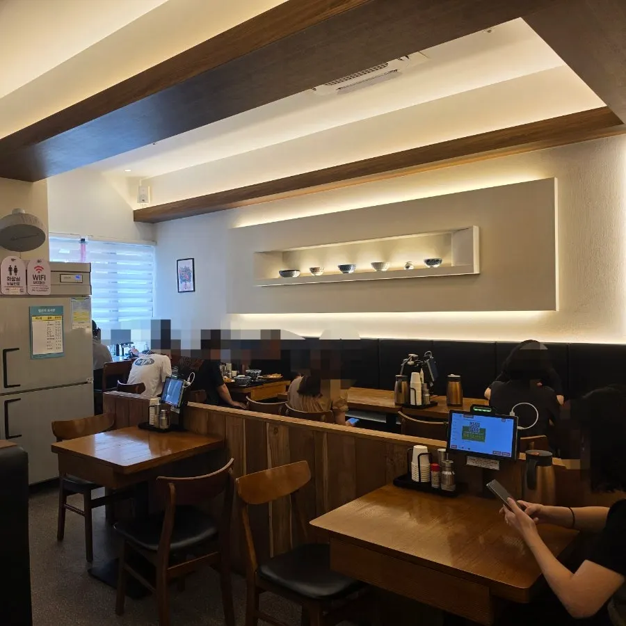 Spacious interior of Kosi Isu Branch packed with customers