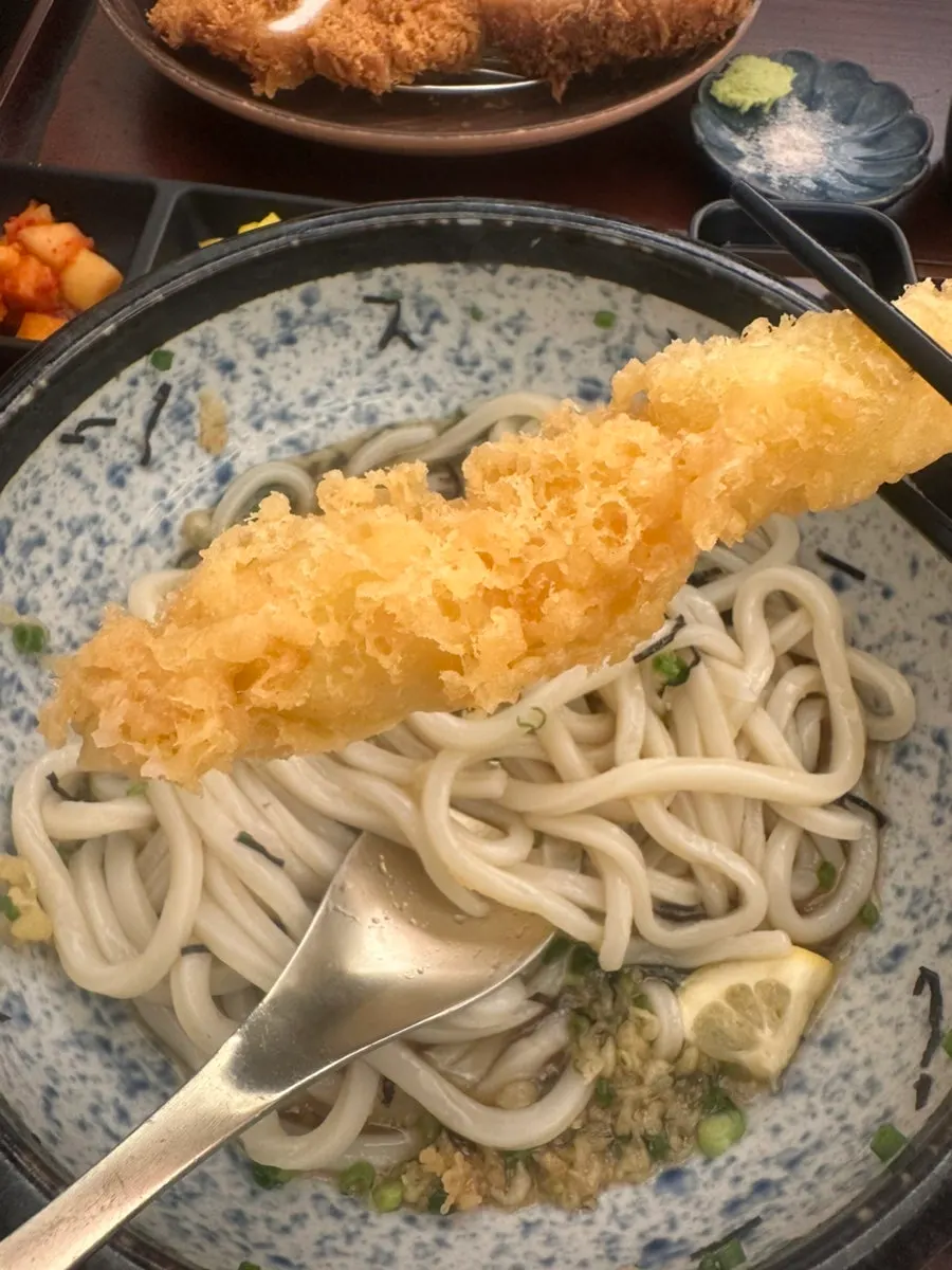 Self-made udon noodles lifted with chopsticks