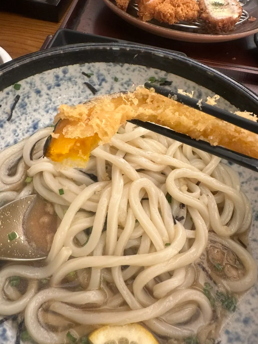 Cold udon served with shrimp tempura and sweet pumpkin tempura