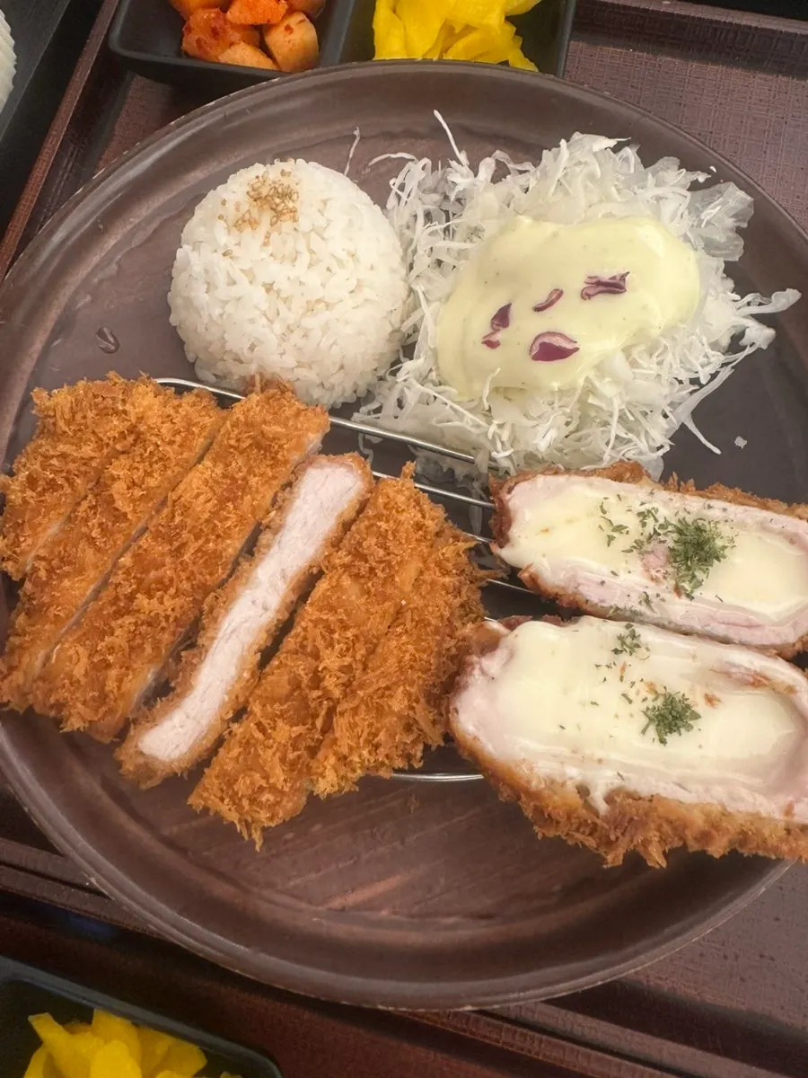 Full meal spread with inari sushi and side dishes