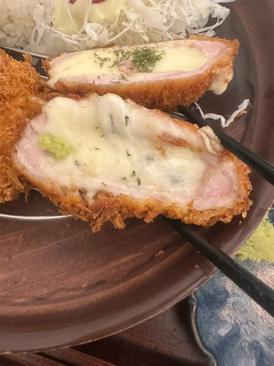 Stretchy melted cheese in handmade cheese katsu