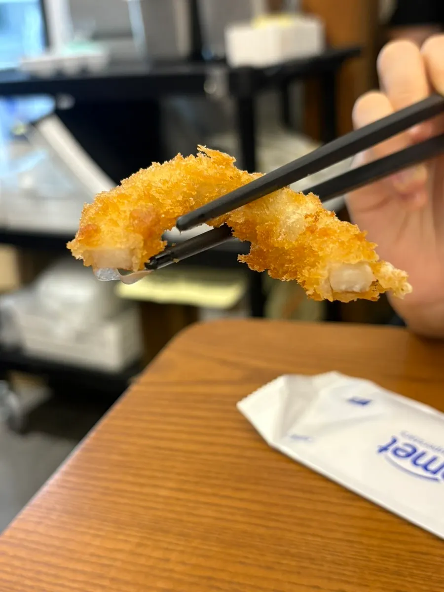 Whole squid rings stretching as they're pulled apart