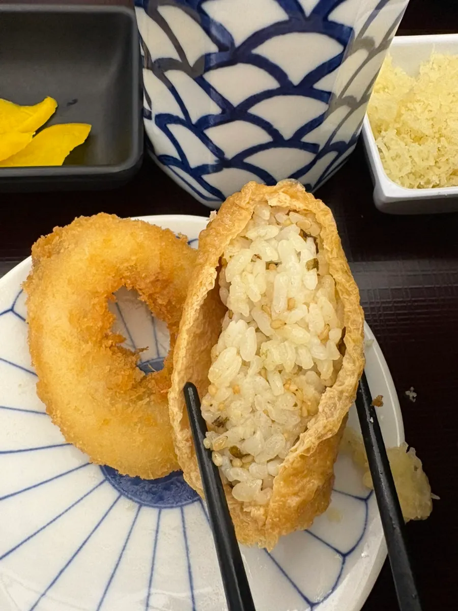 Shrimp tempura and pumpkin tempura served with ten bukkake udon