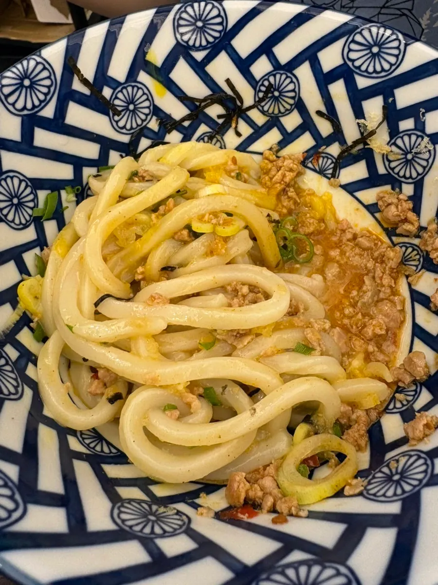 Mazesoba udon mixed with egg yolk and meat