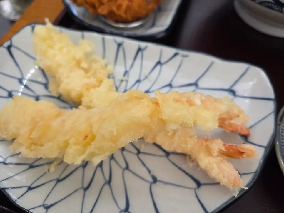 Two pieces of crispy fried shrimp tempura