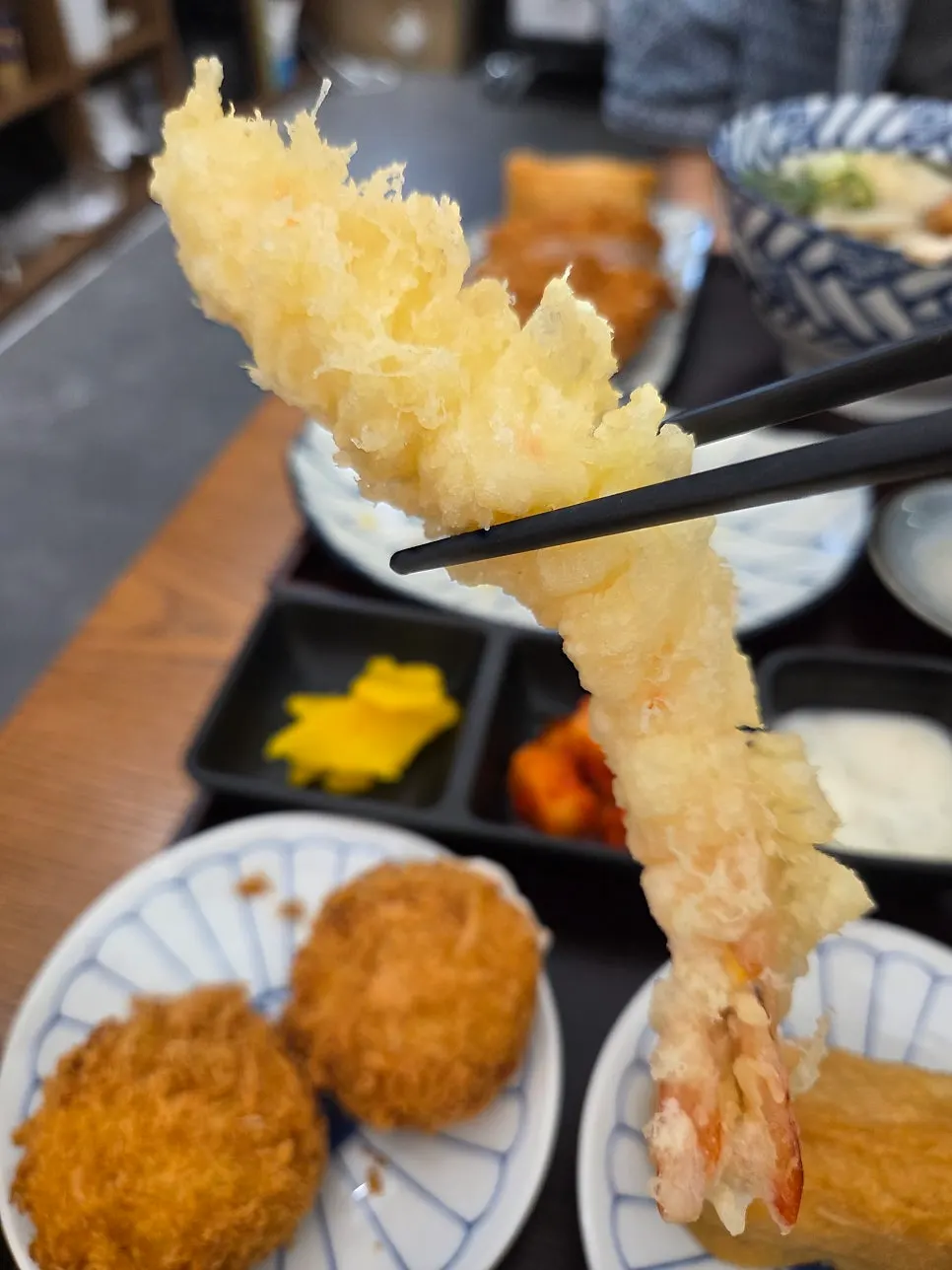 A cross-section of the sweet potato cheese croquette with the side dish plate
