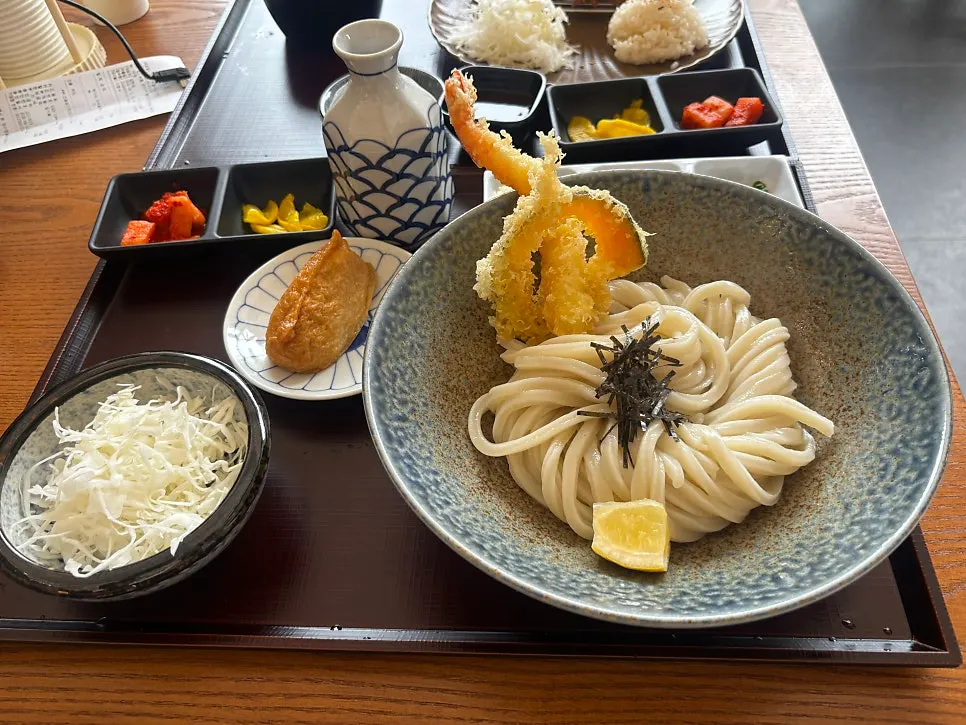 Bukkake udon served with scallion, grated radish, and tempura crumbs