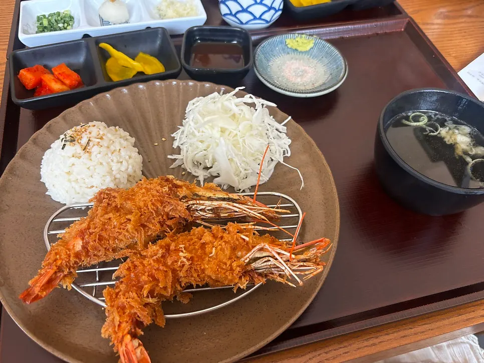 A plate of crispy fried king shrimp katsu