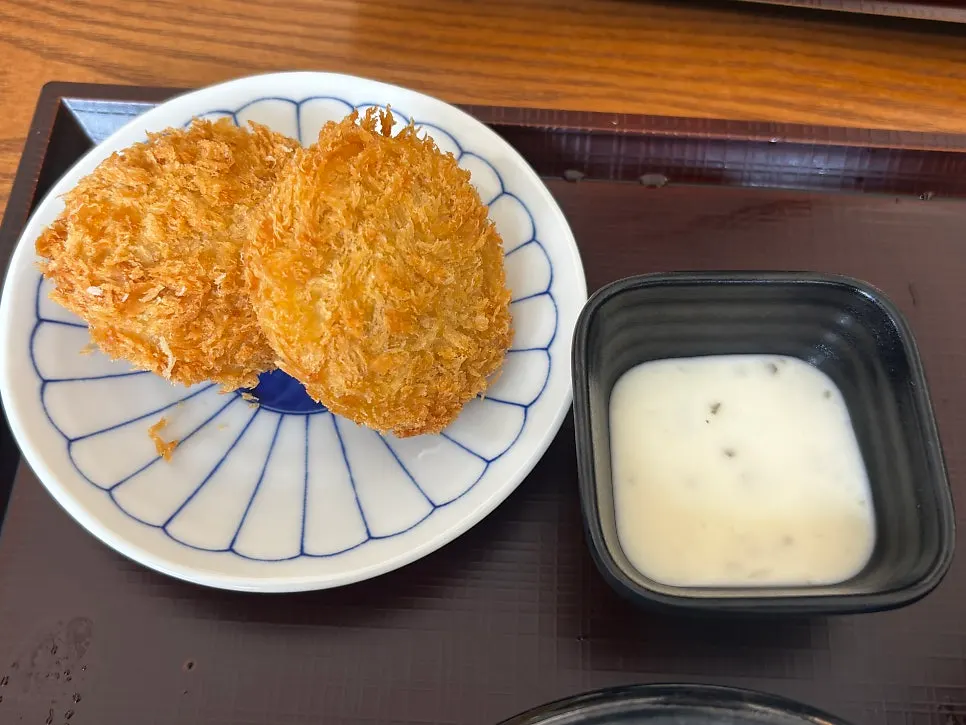 Sweet potato korokke cut in half to show the inside