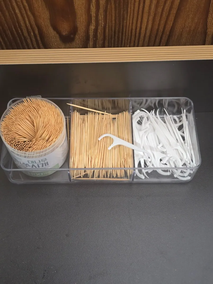 Toothpicks and dental floss set up next to the entrance