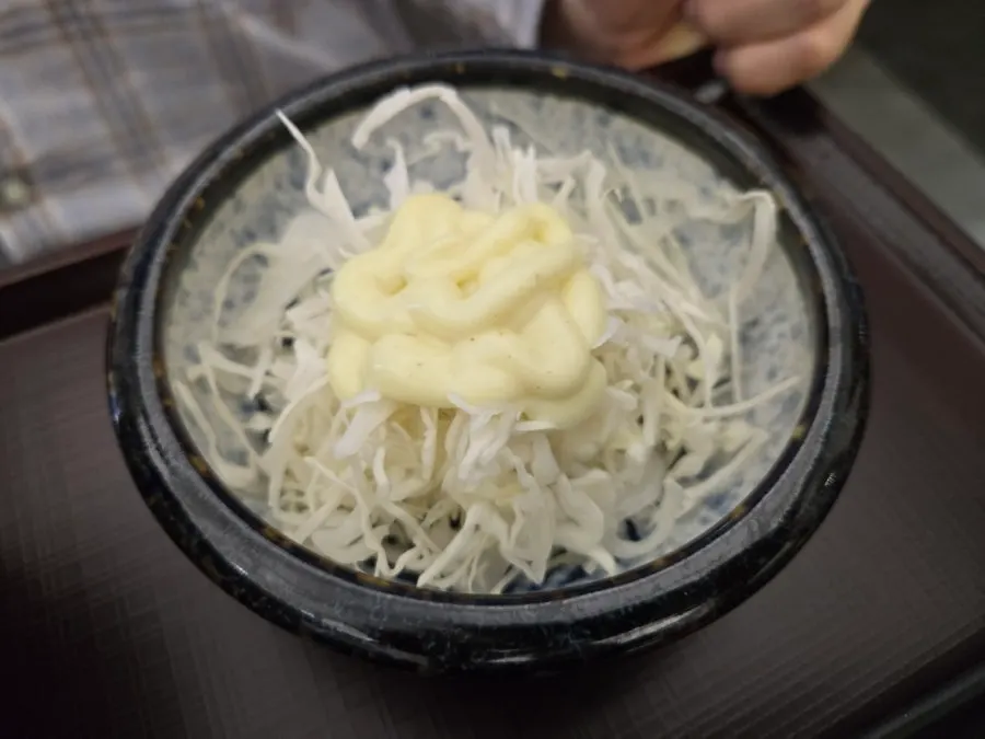 Salad drizzled with dressing
