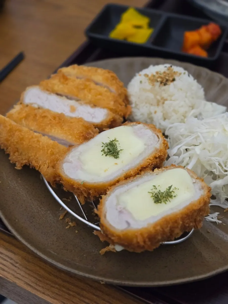Cross-section of the cheese katsu showing melted cheese