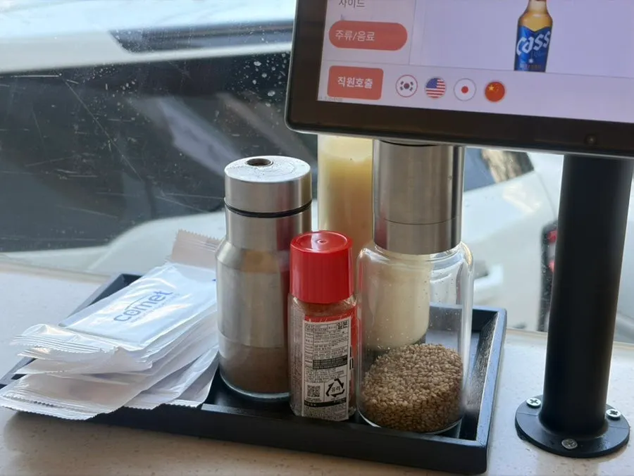 Salt, pepper, sesame and other condiments on the table