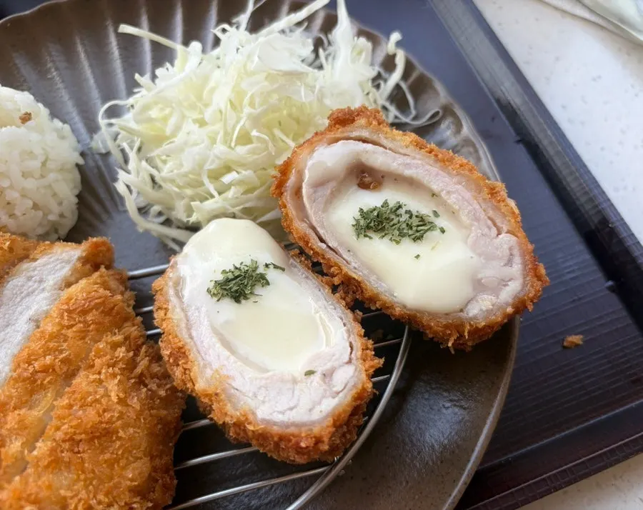A piece of tonkatsu topped with wasabi