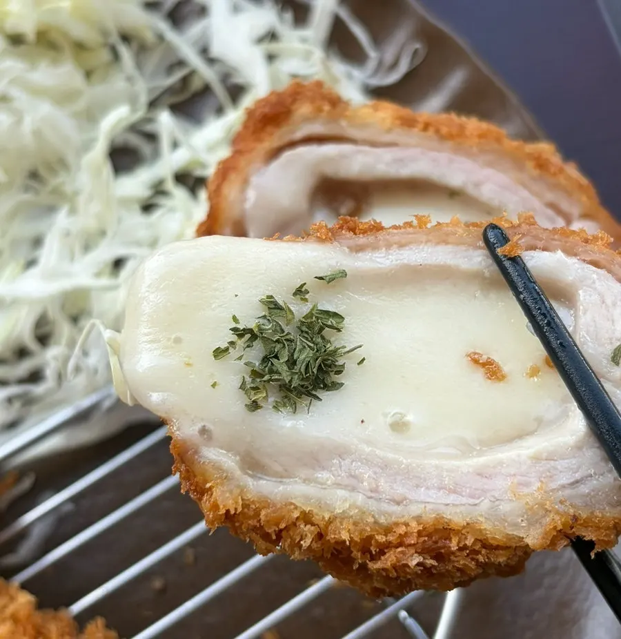 Kosi's cheese katsu with melted cheese oozing out