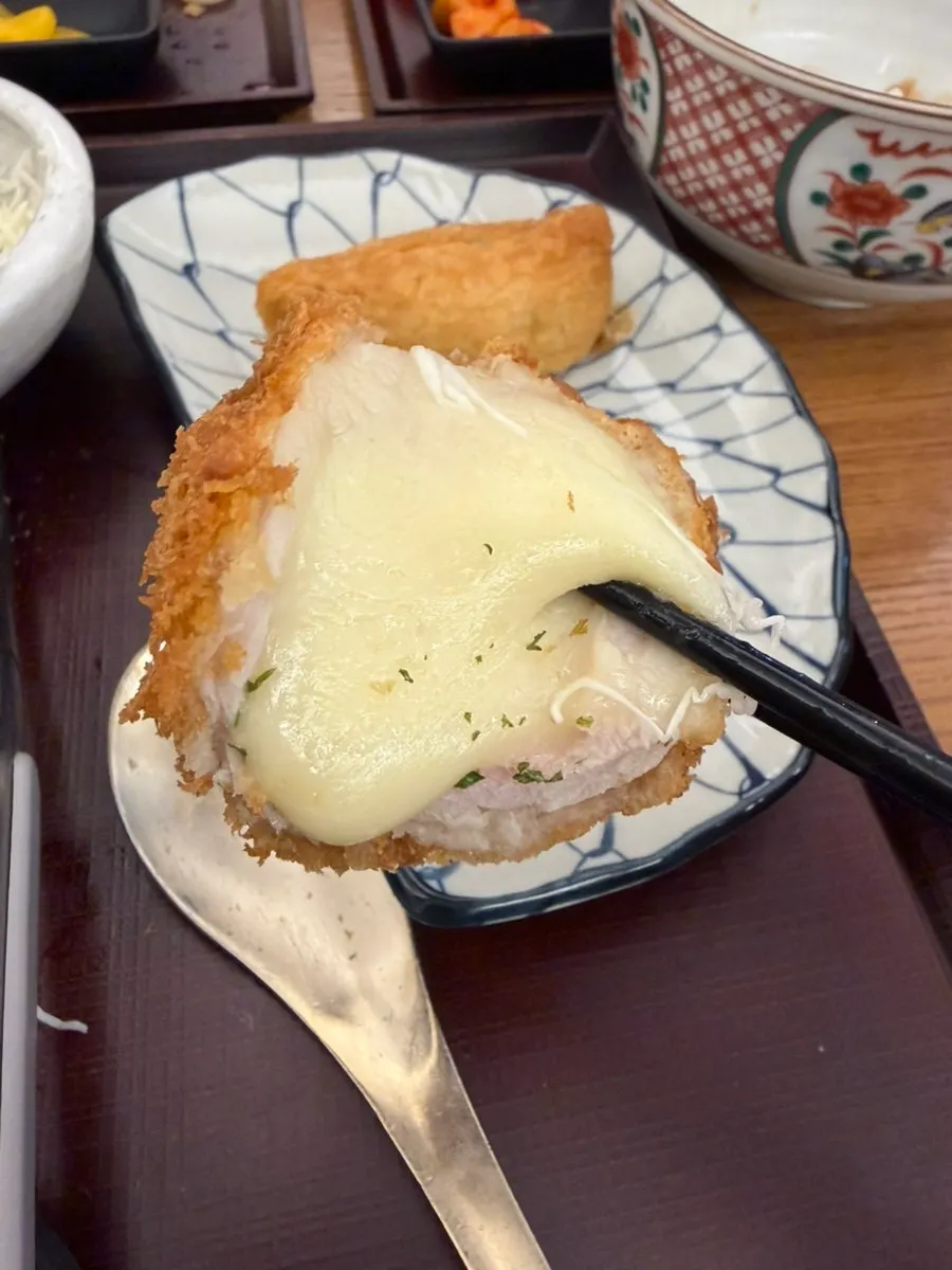 Cross-section of tonkatsu with melted cheese inside