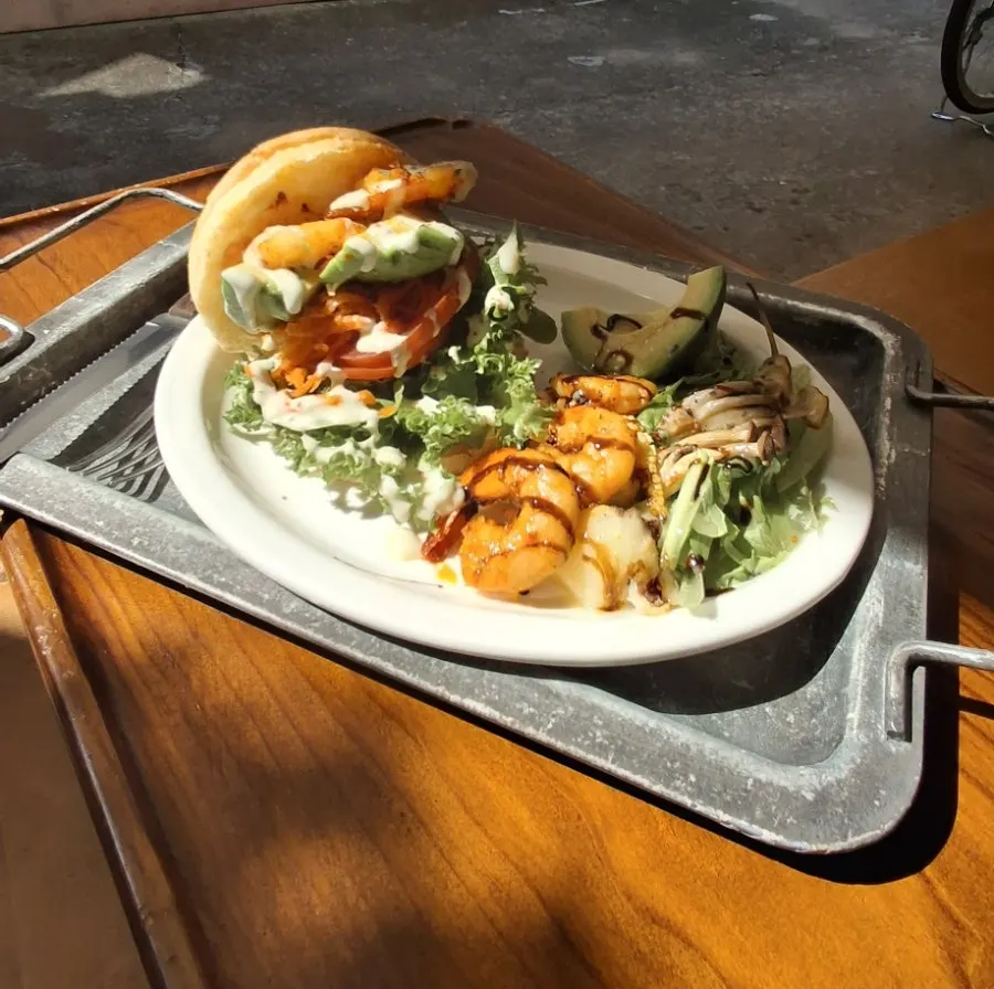 Brunch tray on a small table on the sunlit porch