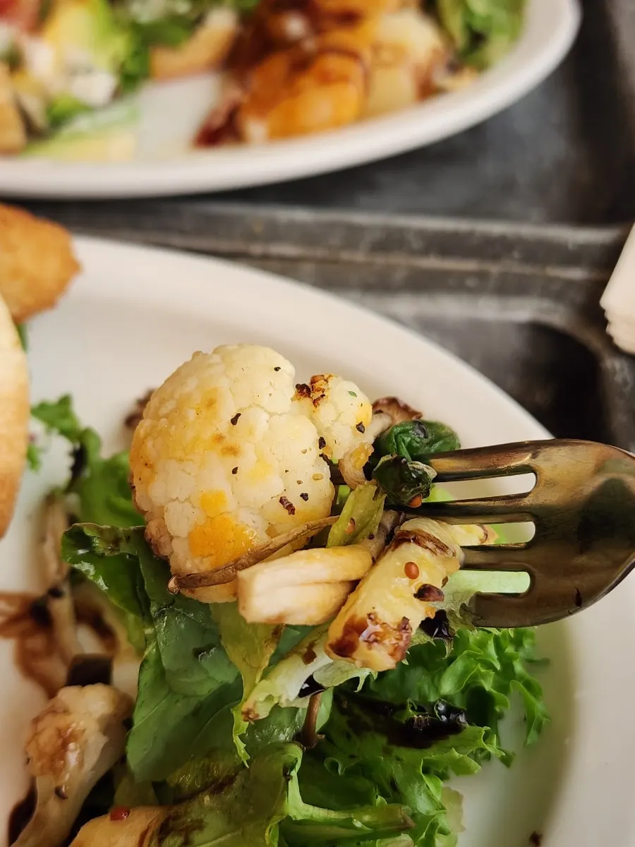 Side of roasted vegetables, mushrooms, and a mini salad