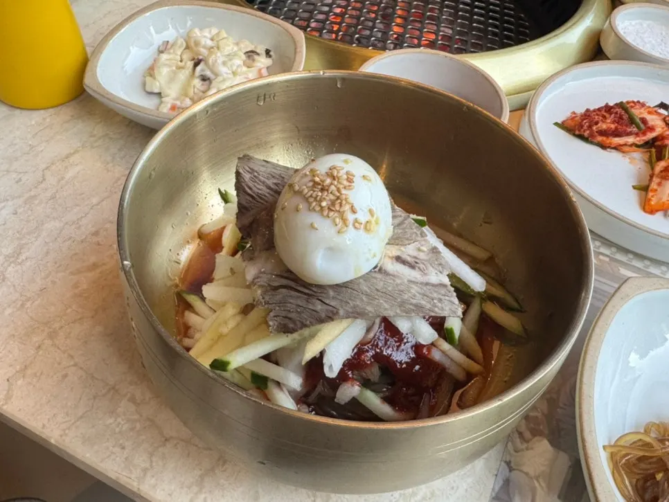 A piece of Seolhwa marinated ribs wrapped in lettuce