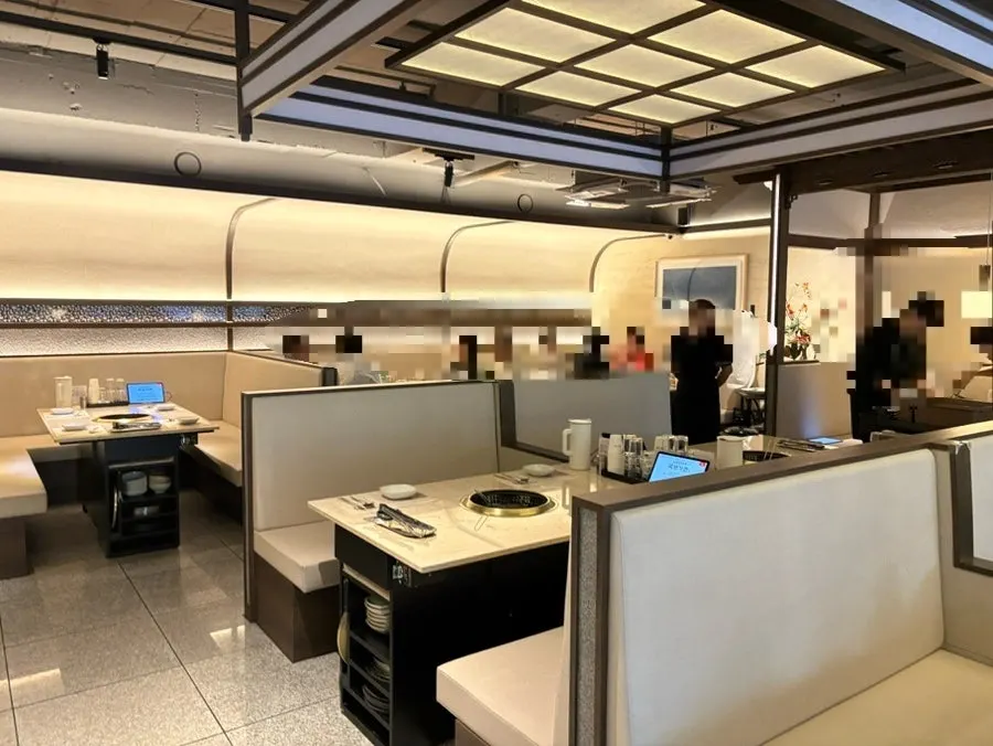 Dining hall table seating divided by low walls