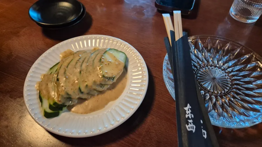 Cucumber appetizer topped with sesame sauce