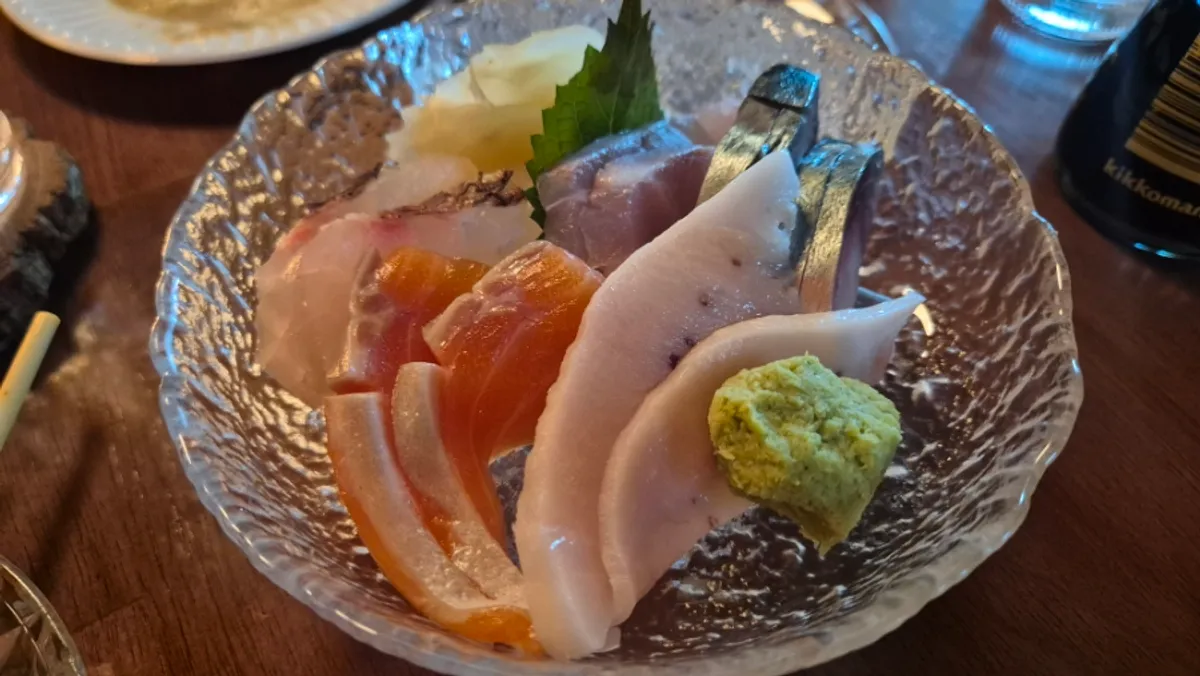 Plate of assorted aged sashimi including croaker, sea bream, and salmon