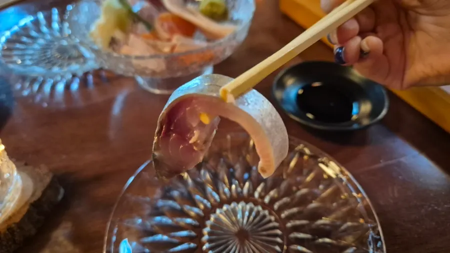 A piece of aged mackerel sashimi