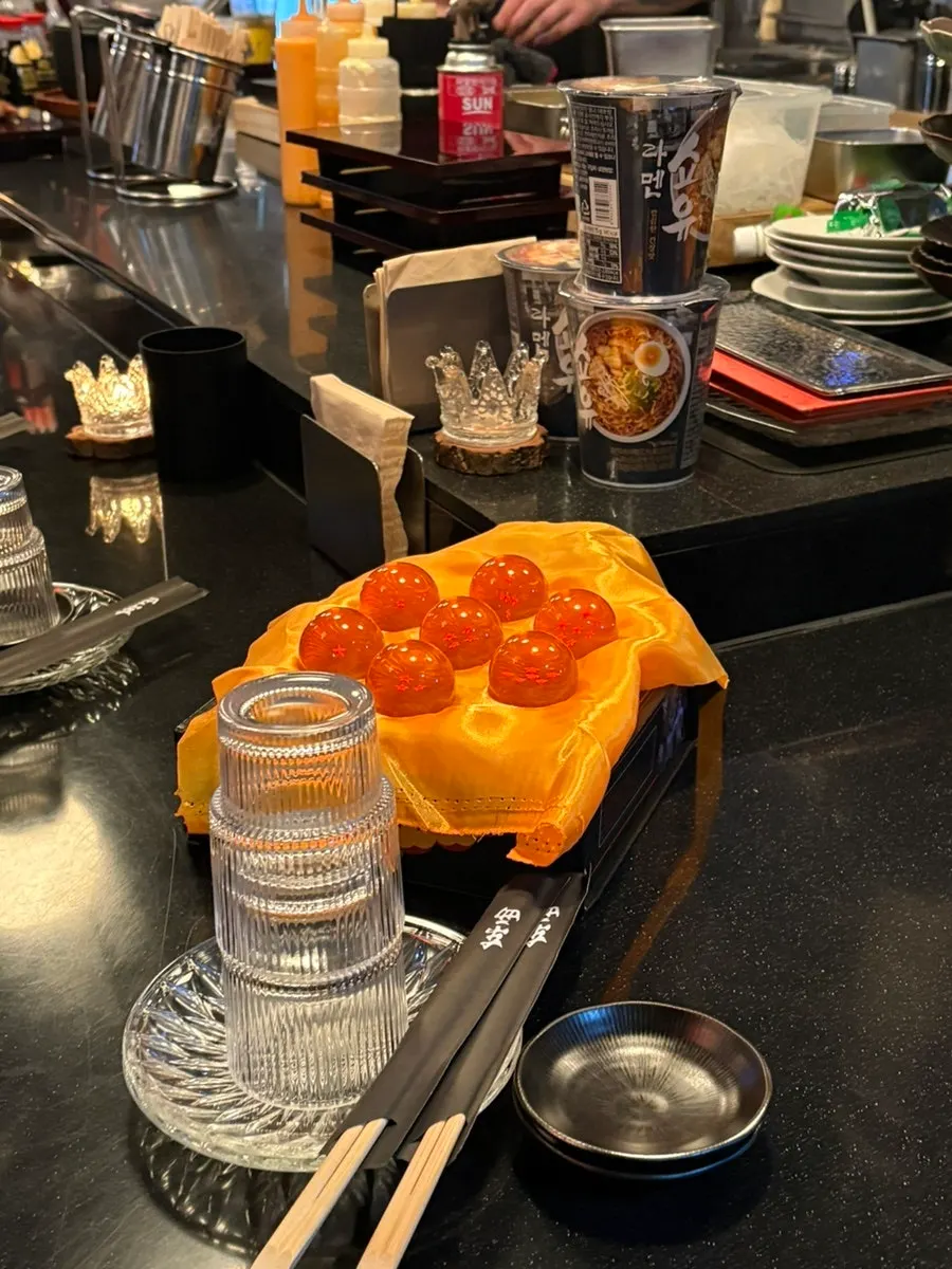 Table seating for 3–4 people in the back of the izakaya