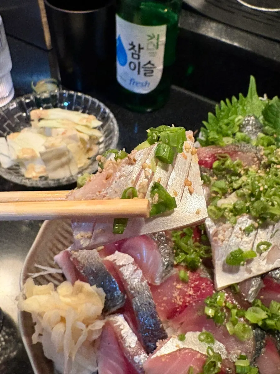 Extra parts served alongside the mackerel sashimi