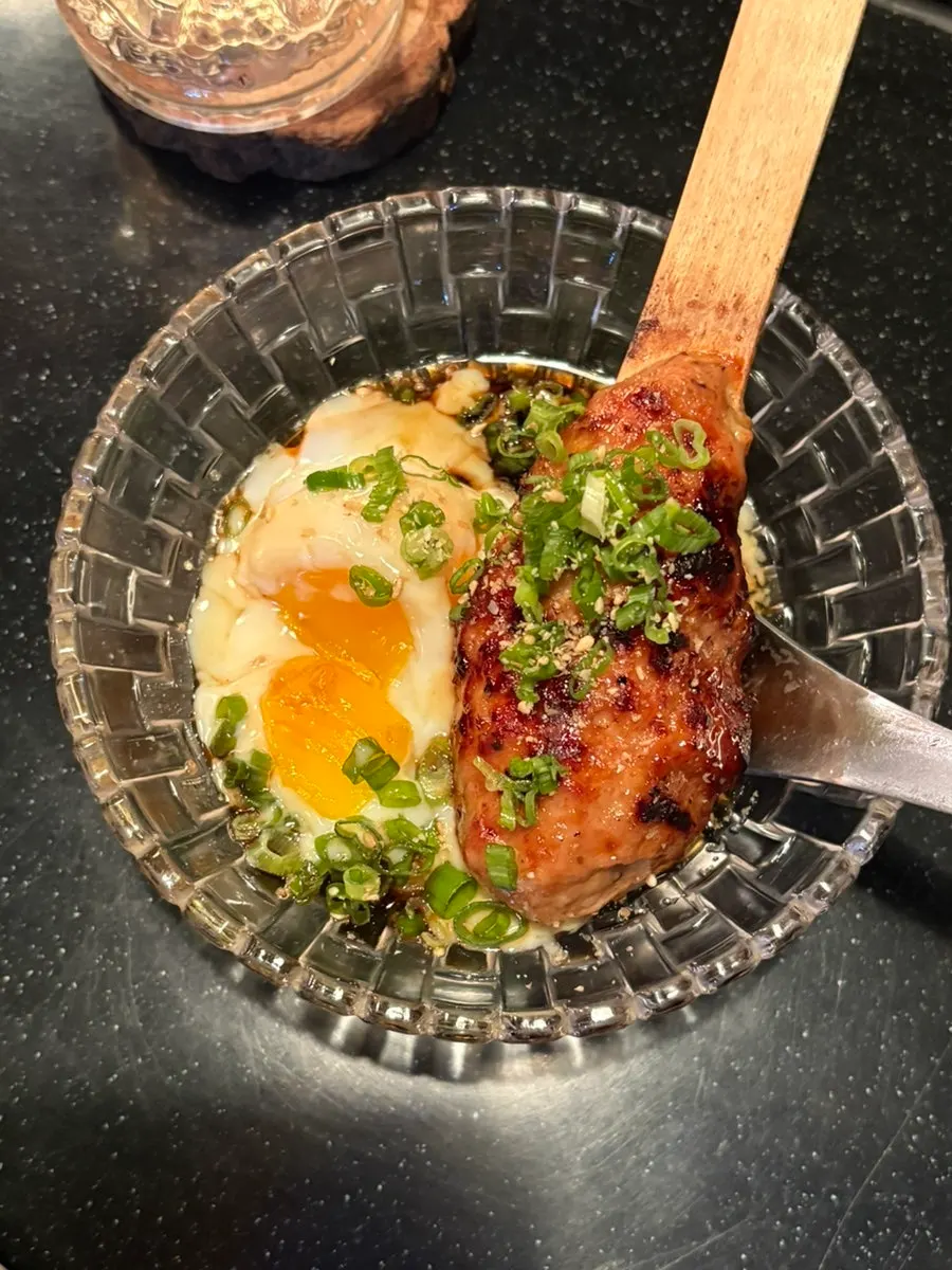 Tsukune served with egg yolk sauce