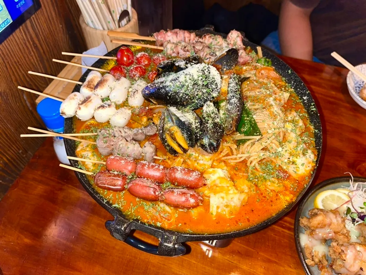 Kushino nabe hot pot filled with skewers and mussels