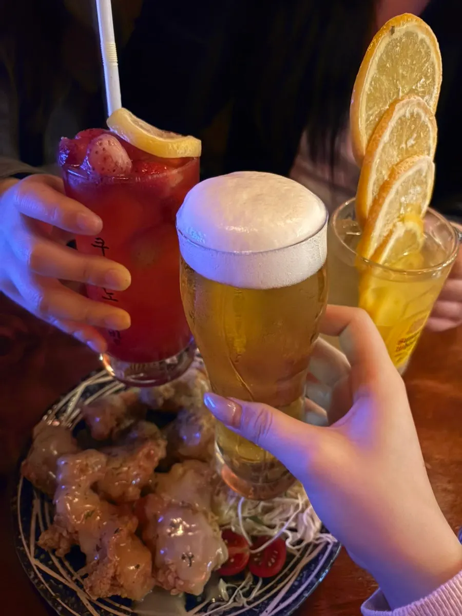Orange highball topped with a tall stack of orange slices
