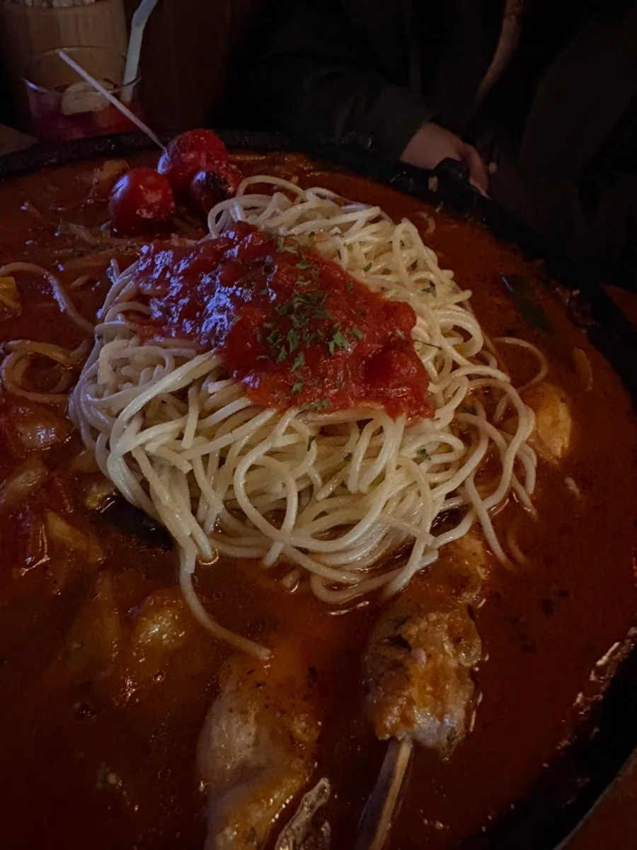 Signature kushino nabe topped with sausage and skewers