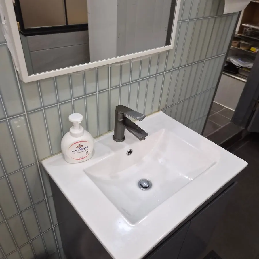 Sink and hand sanitizer inside the restaurant