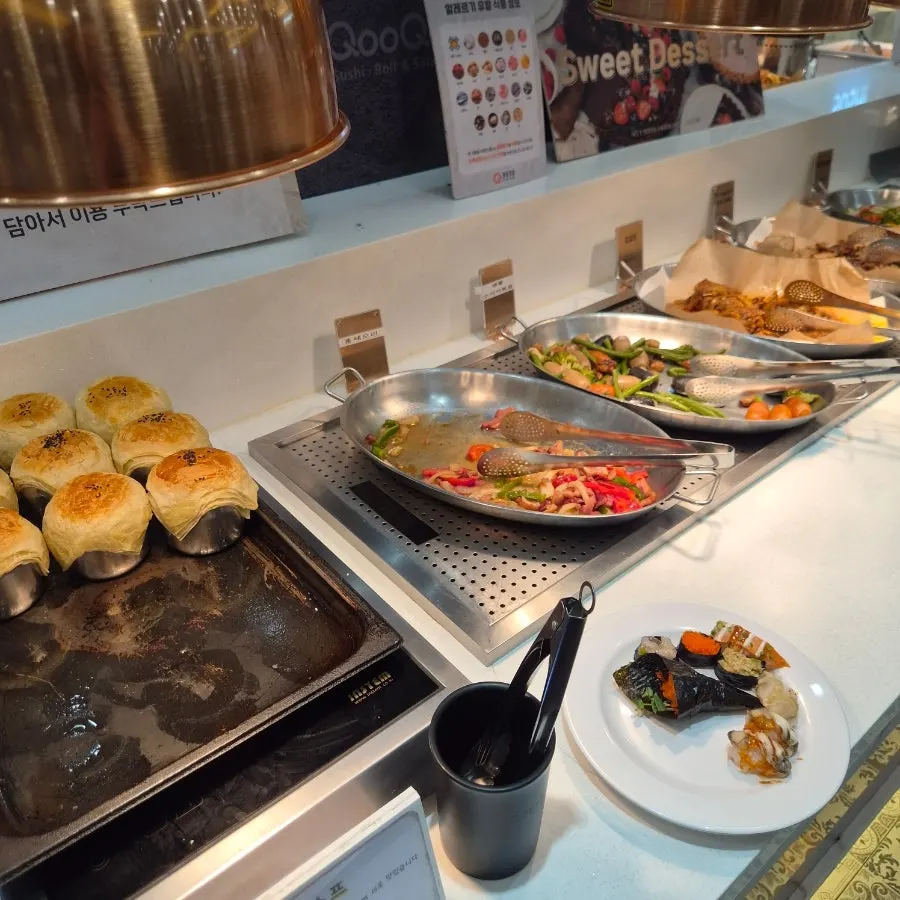 Buffet food stations beyond the sushi corner