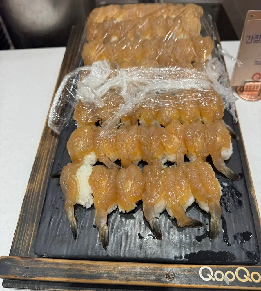 A plate of raw fish sushi