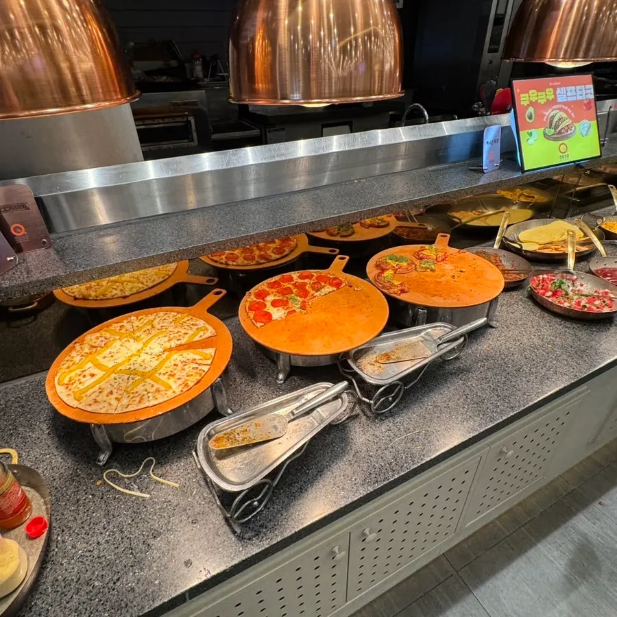 Pizza and quesadillas at the buffet hot food corner