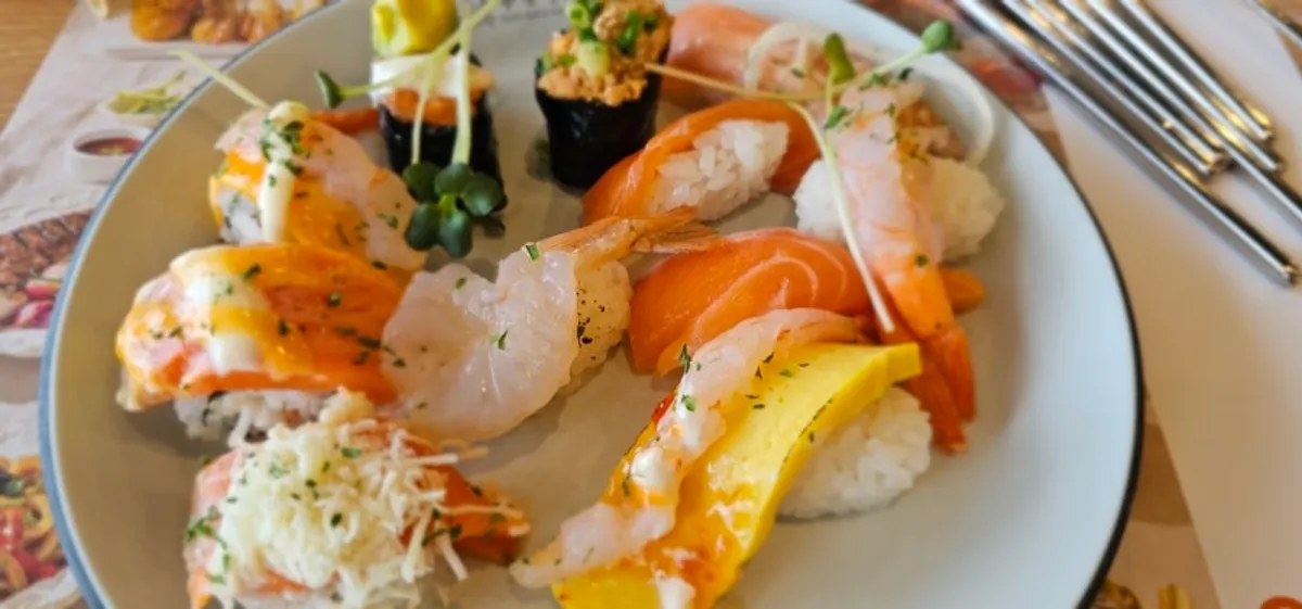 Menu corner at Kuu Kuu Nowon Branch displaying over 100 kinds of sushi