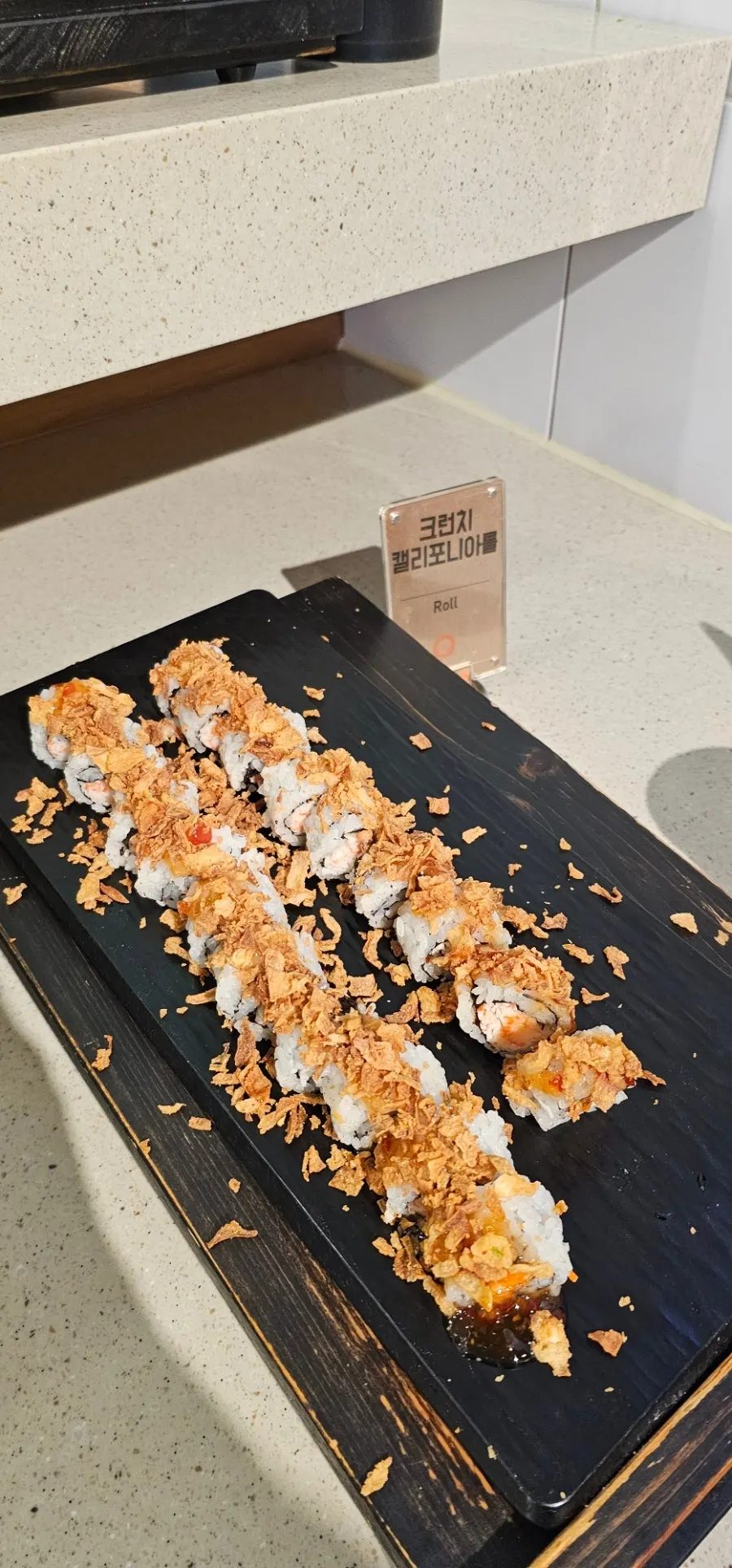 A plate loaded with sushi, rolls, and gunkan