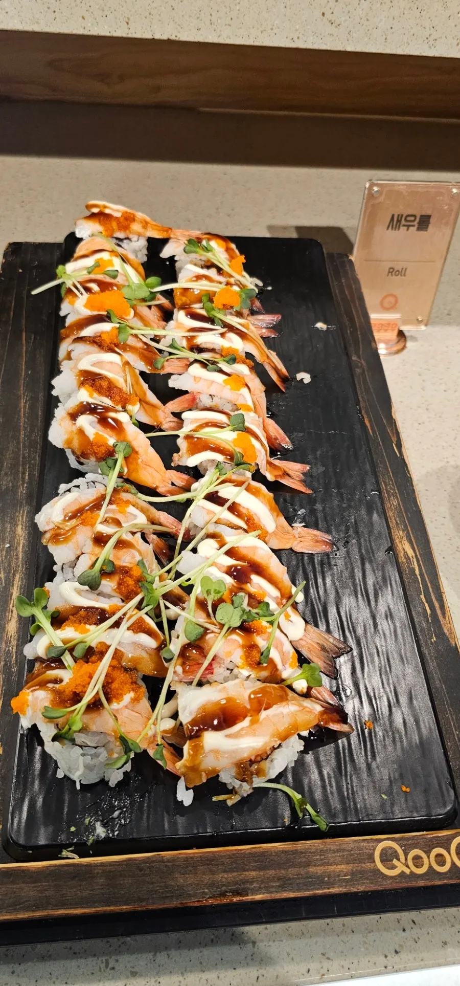 A plate of hand-picked sushi and rolls