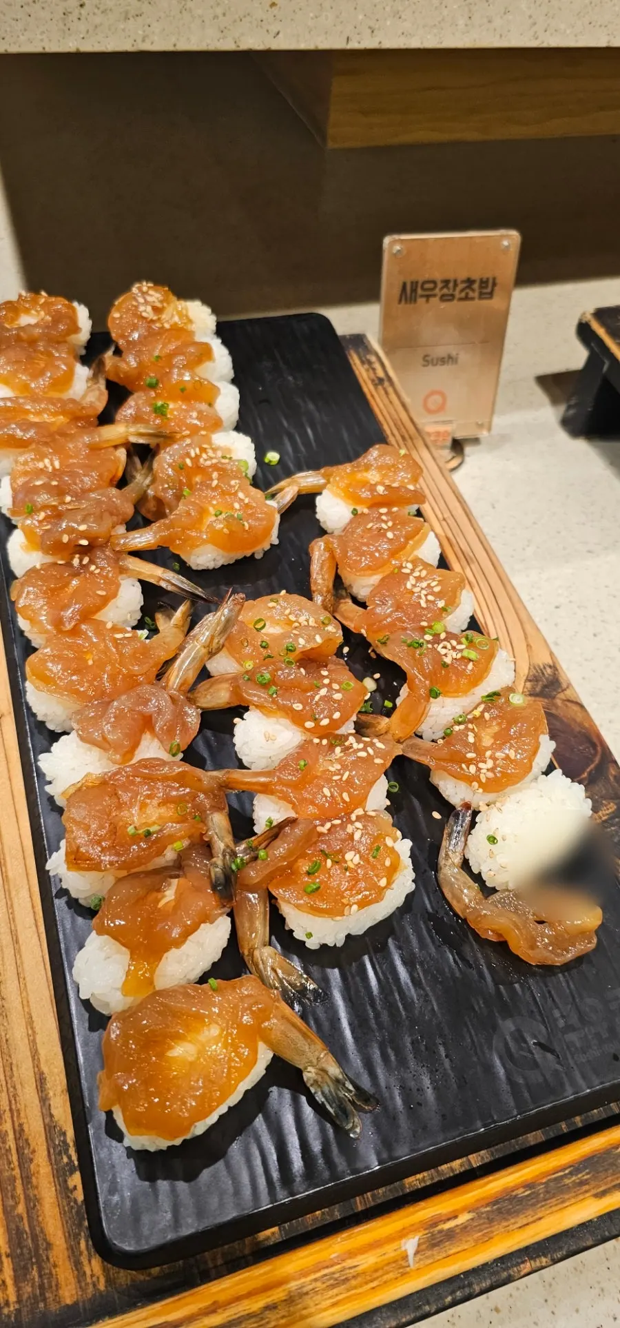 A plate of egg shrimp sushi