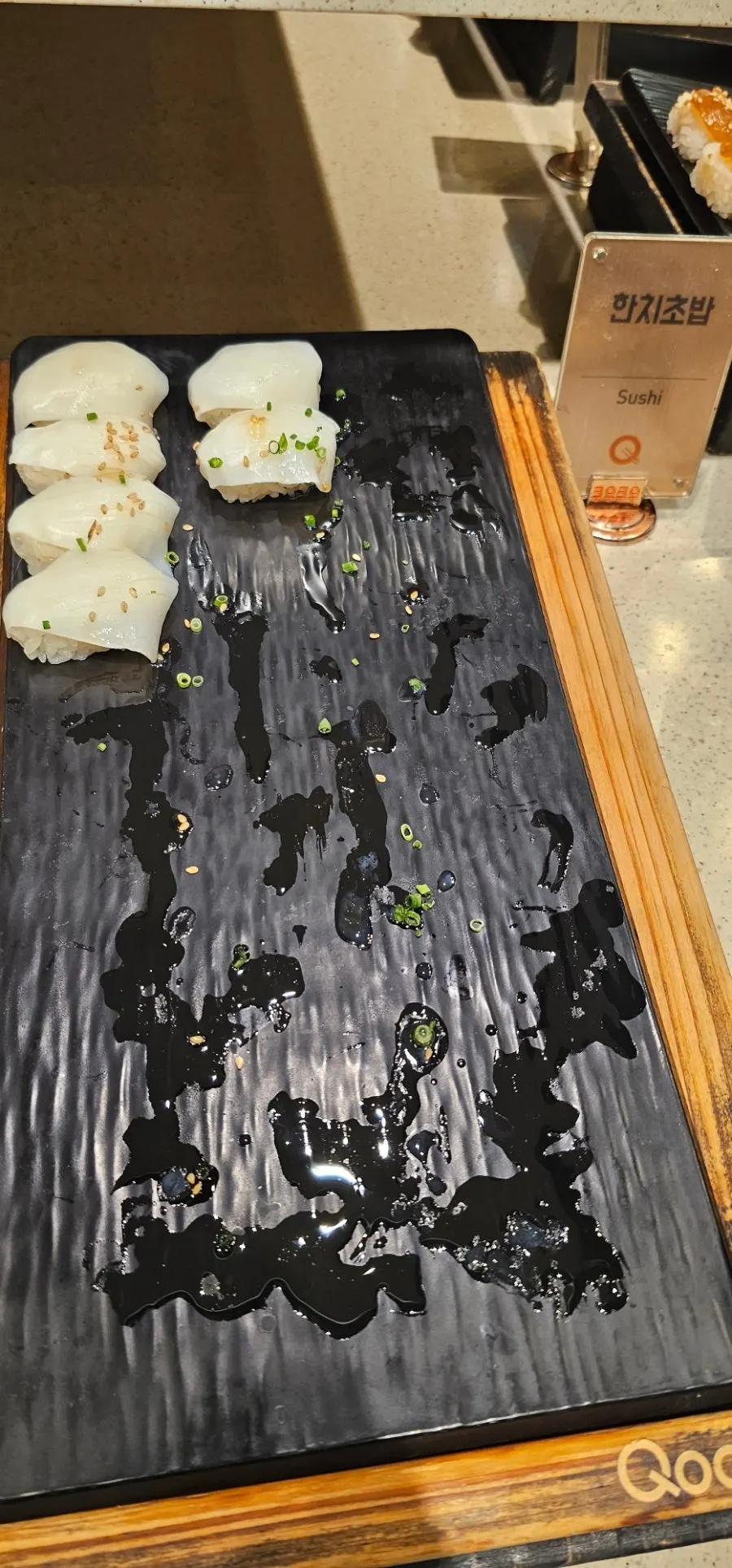 A plate of sushi and gunkan brought over