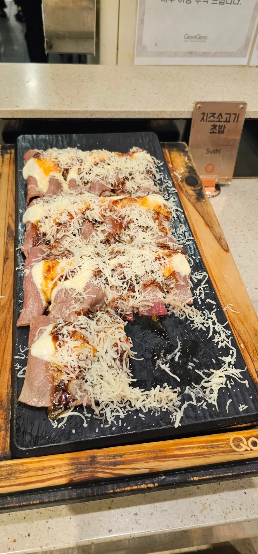 A plate with sushi and seafood dishes