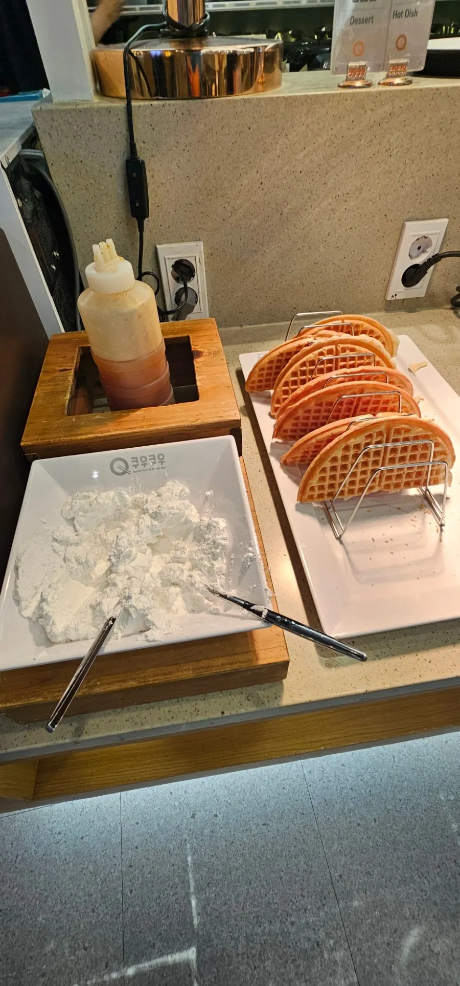 A dessert plate with waffle and ice cream