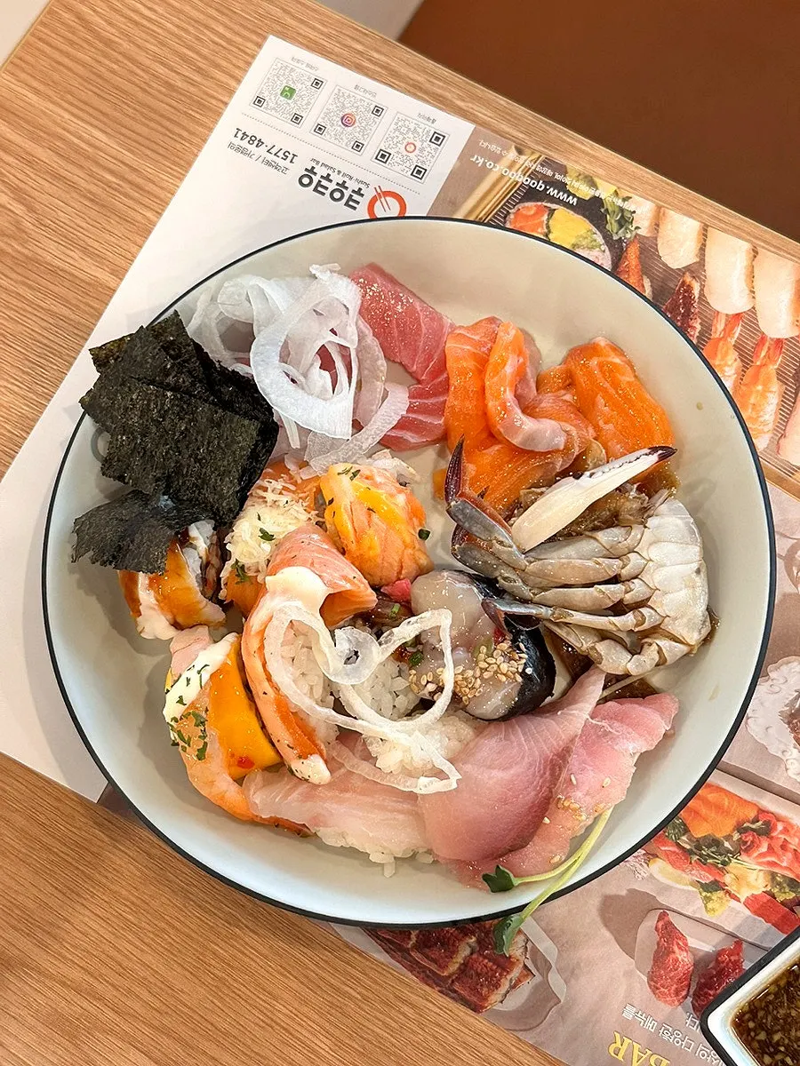 A plate of sushi and rolls